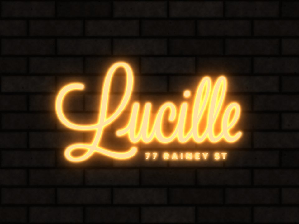 Lucille Patio Lounge logo as a gold neon sign