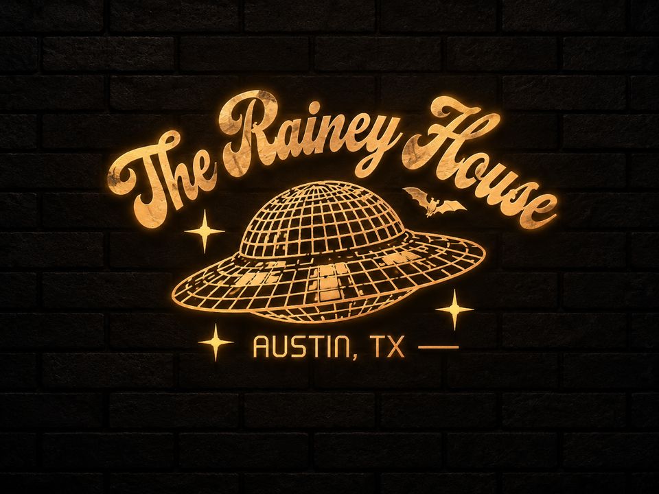 The Rainey House logo as a gold neon sign